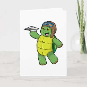 Schildpad als piloot met papieren vliegtuig kaart