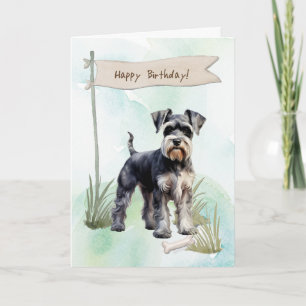 Schnauzer-hond buiten onder verjaardagsbord kaart