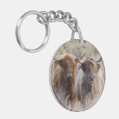 Schotse hooglandkoeien in het gras sleutelhanger (Voorkant Links)