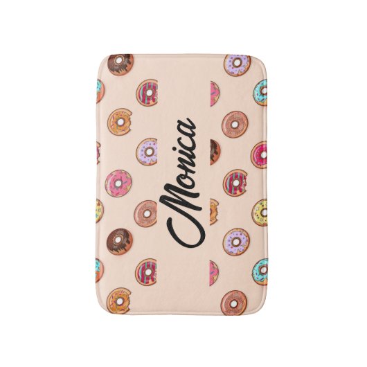 Schuddecoratieve donuts op roze badmat (Voorkant Verticaal)