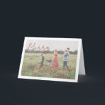 Script rustique Photo moderne Noël<br><div class="desc">Carte de Noël photo moderne avec un design simple et minimal avec "Joyeux Noël" dans un élégant script rouge rustique sur votre photo préférée avec votre nom de famille. Le modèle comprend une superposition blanche pour aider le texte à se démarquer sur votre photo et peut être supprimé dans l'outil...</div>