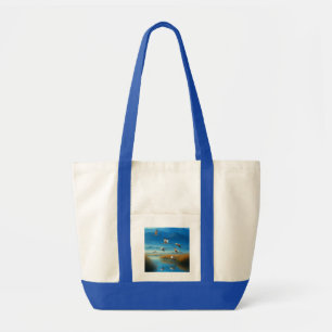 Serene natuur meer scène met vliegende kraanvogels tote bag