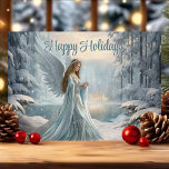 Serene Winter Angel Noël<br><div class="desc">Cette carte de Noël élégante présente un ange d'hiver serein debout dans une forêt enneigée, symbolisant la paix et la grâce pendant la période des fêtes. Avec un bleu doux et une neige chatoyante, ce design rayonne de calme et de tranquillité, ce qui en fait un beau choix pour envoyer...</div>