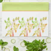 Serviette de cuisine orangée et verte à motifs flo (Plié)