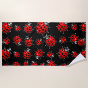 Serviette de plage aux coccinelles