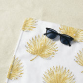 Serviette de plage aux feuilles de palmier dorées  (En situation)