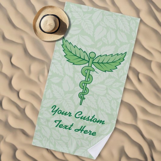 Serviette De Plage Caducée avec fond de feuilles