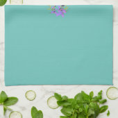 Serviette de table violette sur un dos vert luxuri (Plié)