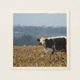 Serviette En Papier Black and White Cow grazes in freshly plowed field