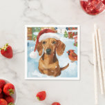 Serviette En Papier Dachshund Winter Wonderland Christmas Joy<br><div class="desc">Ce design festif reflète l'esprit joyeux de la période des fêtes, avec un adorable petit portant un chapeau de Père Noël. Le chien est niché dans un pays des merveilles hivernales, avec un bonhomme de neige, un sapin de Noël décoré et des cadeaux joliment emballés. Les flocons de neige tombent...</div>