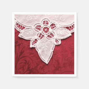 Serviette En Papier Dentelle blanche sur tissu rouge
