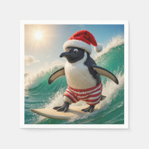 Serviette En Papier Manchot de Noël surfant sur une vague océanique