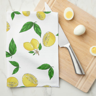 Serviettes de cuisine avec citrons juteux et feuil