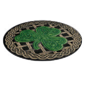 Shamrock noir sur la planche à découper des noeuds (Coin)