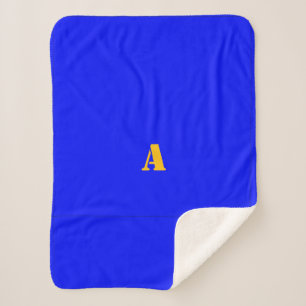 Sherpa Une couverture en polaire bleu monogramme