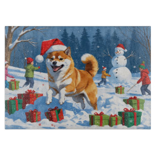 Shiba Inu hardlopend in de sneeuw met kerstmuts Snijplank