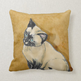 Siamese kat op goud kussen