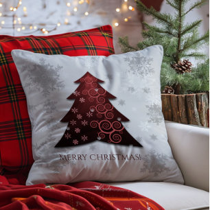Sierkussen met rode kerstbomen
