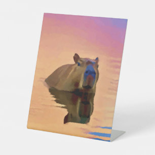 Signe De Table Capybara émergeant d'un plan d'eau paisible