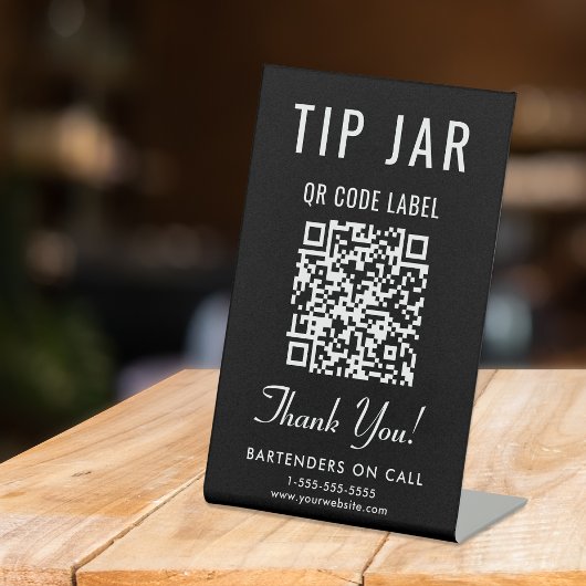 Signe De Table Code QR du pot à pourboires noir sur table