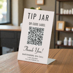 Signe De Table Code QR du pot à pourboires rose sur table