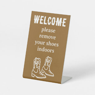Signe De Table Enlever les chaussures Bottes de cowboy Location d