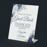 Signe De Table Rustic Blue Boho Floral S'Il Vous Plaît Signer Not<br><div class="desc">Ce magnifique panneau de piédestal fera invitation vos invités mariages à signer votre livre d'or. Il présente un design boho floral rustique avec des roses d'aquarelle peints à la main dans des tons bleu poussiéreux, bleu marine et indigo. Il y a de la place pour les noms du couple ainsi...</div>