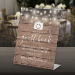 Signe De Table Rustic Wood String Lights Photo Livre d'invité<br><div class="desc">Cette élégante affiche du livre d'or est parfaite pour toutes les célébrations,  avec de jolies lampes à cordes sur un arrière - plan en bois rustique. Conçu par Thisisnotme©</div>
