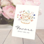 Signe De Table Tea Party préfère le guéridon<br><div class="desc">Laissez votre journée spéciale fleurir avec Tea Party favorise le signe de piédestal! Ce design présente de superbes fleurs d'aquarelle peintes à la main dans des teintes de violet profond, de bleu poussiéreux et de rose roux avec de la végétation sauge. Que vous soyez l'hôte d'une fête de jardin ou...</div>