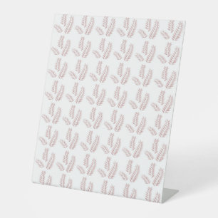 Signe De Table un arrière - plan blanc avec des feuilles roses
