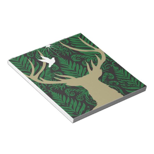 Silhouette van een hert, een duif en een ster tege notitieblok (Schuin)