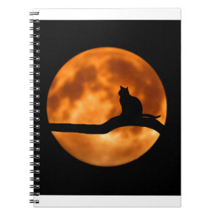 Silhouette van een zwarte kat in een boom notitieboek