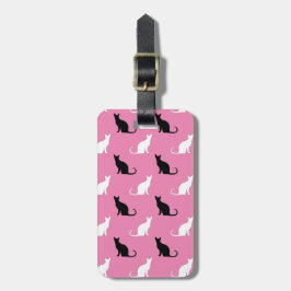 Silhouetten van zwarte en witte katten op roze bagagelabel