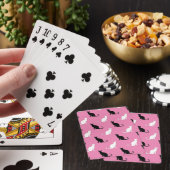 Silhouetten van zwarte en witte katten op roze pokerkaarten (Insitu)