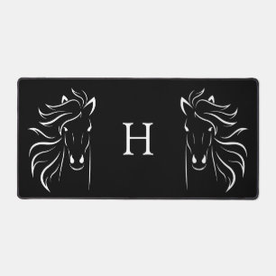 Silhouettes de chevaux et monogramme sur fond noir