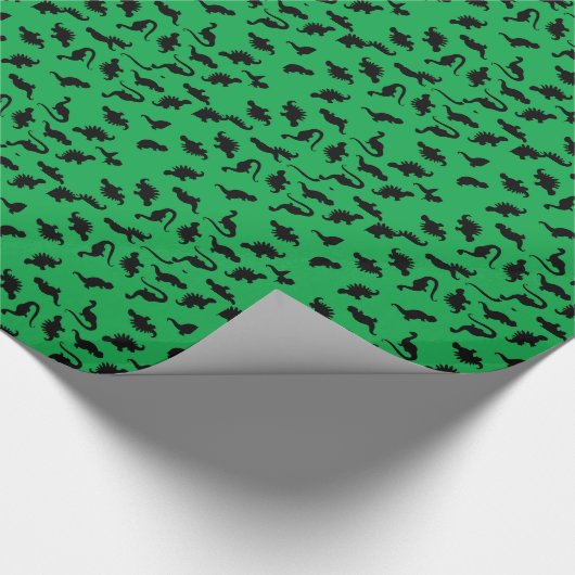 Silhouettes de dinosaures sur papier cadeau vert m (Coin)