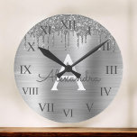 Silver Glitter Brushed metal Monogram<br><div class="desc">Silver Faux Foil Metallic Sparkle Glitter Brushed Metal Monogram Name and Initial Luxury Wall Clock. This makes the perfect sweet 16 birthday,  wedding,  bridal shower,  anniversary,  baby shower or bachelorette party gift for someone that loves glam luxury and chic styles.</div>