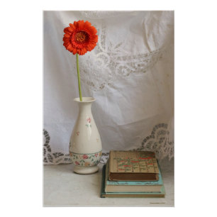Sinaasappel gerbera en boeken poster perfect poster