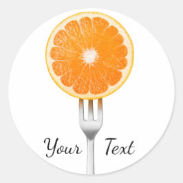 Sinaasappel op een vork ronde sticker