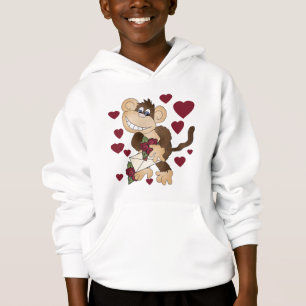 Singe avec des T-shirts et des cadeaux de roses