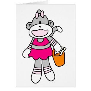 Singe de chaussette de fille à la plage