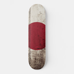 Skateboard Le drapeau japonais sur le vieux grain de bois