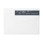 Skatteuse sneeuwomslag rond het etiket van het ter (Achterkant)