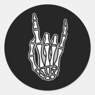 Skelet hand met rots- en rolbord ronde sticker