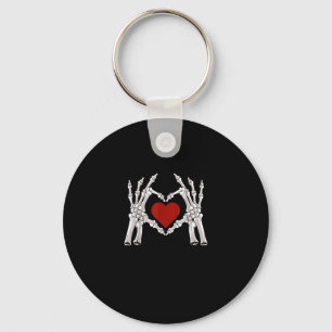 Skelet handen vormen een hart met een rood hart sleutelhanger