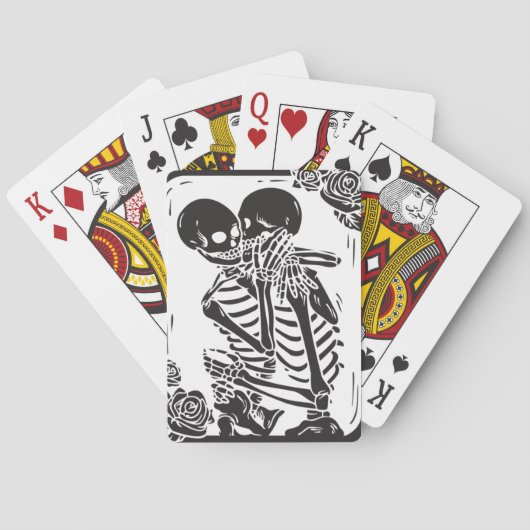 Skeletverdichtingskoppel op een set pokerkaarten (Achterkant)
