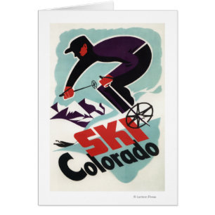 Skieur noir et par pourpre vêtu