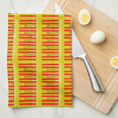 Skis rouges sur serviette de cuisine jaune (Quart Plié)