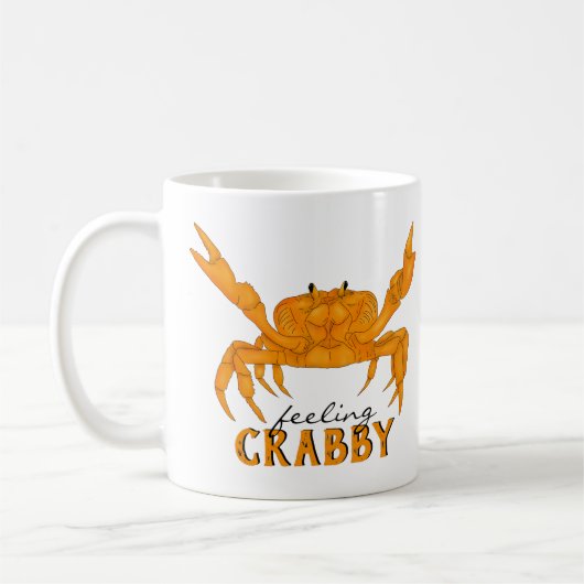 Slagkrabby, oranje krab koffiemok (Links)