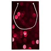 Slankerend kerstfeest met rode kerstlampjes Bokeh Klein Cadeauzakje (Achterkant)